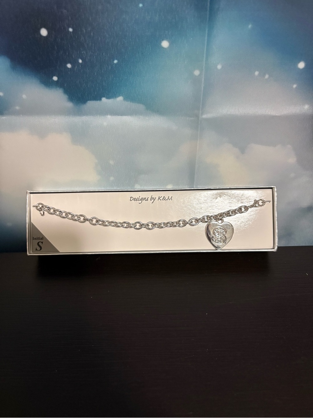 Designs by K & M silver toned chain bracelet with a heart charm “S” initial. NIB